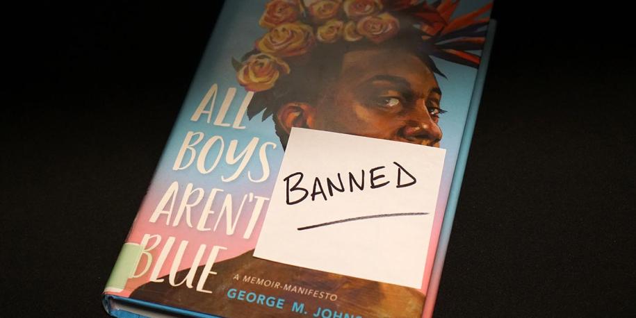 Photo: Frequently banned title with post-it reading banned on cover
