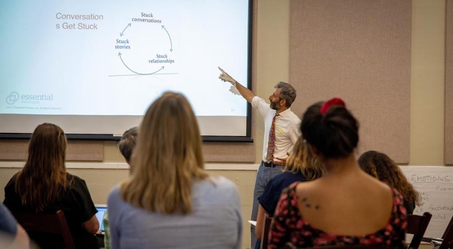 Photo: EP's John Sarrouf pointing at presentation projection (credit Buck Butler)