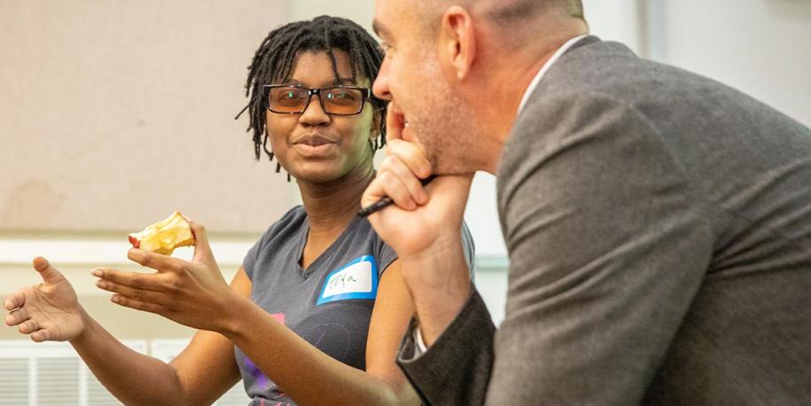 Photo: Two people speaking during an EP training (credit Buck Butler)